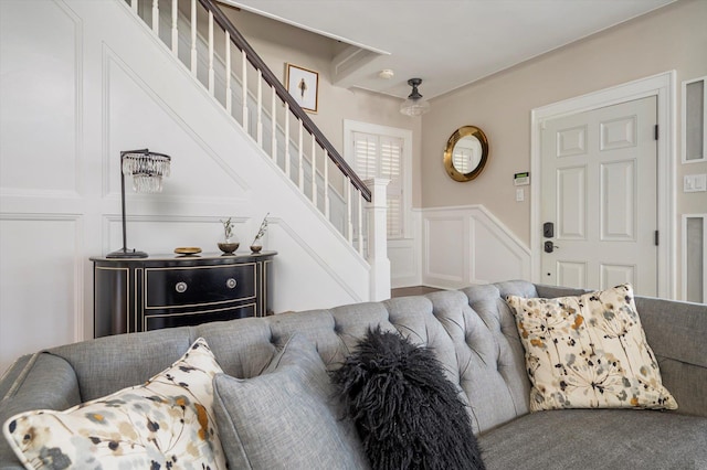 344 N Forest Ave, Rockville Centre, NY 11570 - living area featuring a decorative wall, stairs, and a wainscoted wall