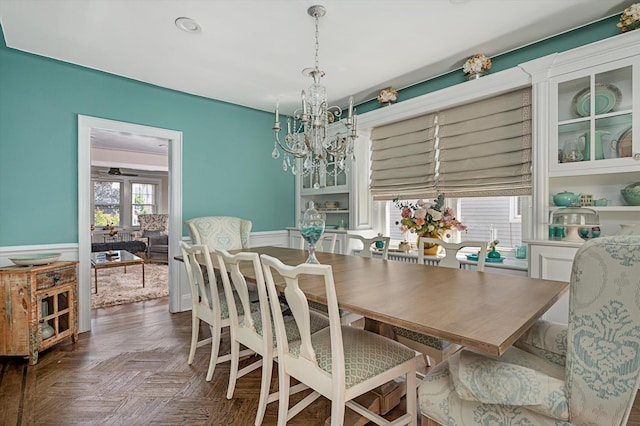 344 N Forest Ave, Rockville Centre, NY 11570 - dining space featuring wainscoting and a chandelier