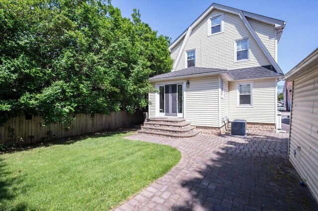 344 N Forest Ave, Rockville Centre, NY 11570 - rear view of property with entry steps, central AC unit, a patio, a gambrel roof, and roof with shingles