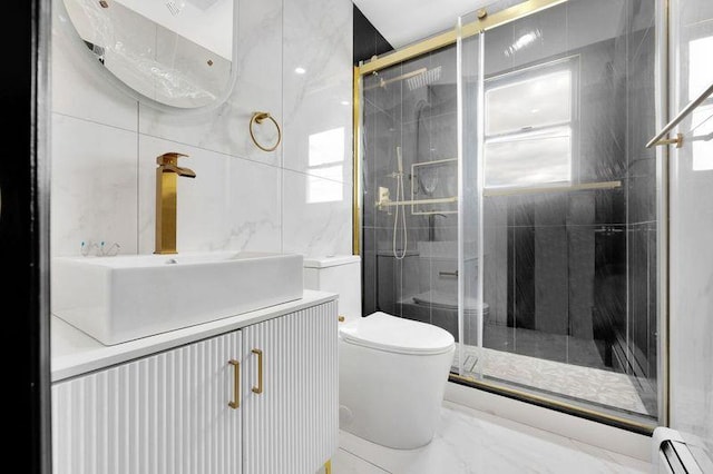 23 Vinton St, Long Beach, NY 11561 - bathroom with toilet, a baseboard heating unit, vanity, and a stall shower
