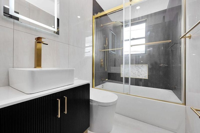 23 Vinton St, Long Beach, NY 11561 - full bathroom with toilet, vanity, and bath / shower combo with glass door