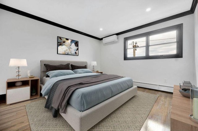 23 Vinton St, Long Beach, NY 11561 - bedroom with a wall mounted AC, a baseboard heating unit, ornamental molding, light wood finished floors, and recessed lighting