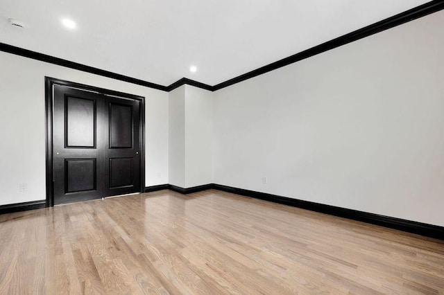 23 Vinton St, Long Beach, NY 11561 - unfurnished room featuring ornamental molding, light wood-style floors, baseboards, and recessed lighting