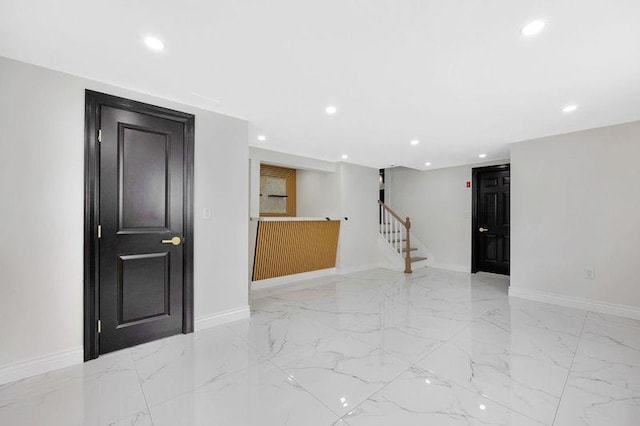 23 Vinton St, Long Beach, NY 11561 - empty room featuring light marble finish floors, stairway, recessed lighting, and baseboards