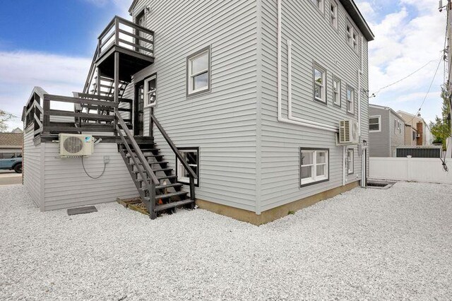 23 Vinton St, Long Beach, NY 11561 - view of side of home with stairs and a cooling unit