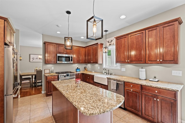 22 Restorative Ln, Middletown, NY 10940 - kitchen featuring stainless steel appliances, a sink, light tile patterned floors, a kitchen island, and pendant lighting