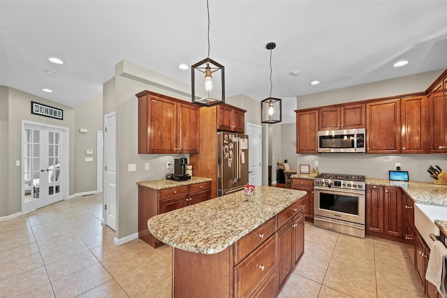 22 Restorative Ln, Middletown, NY 10940 - kitchen with premium appliances, a center island, light tile patterned flooring, light stone counters, and recessed lighting