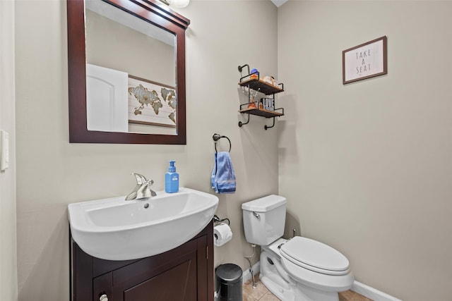 22 Restorative Ln, Middletown, NY 10940 - half bathroom with vanity, toilet, tile patterned floors, and baseboards