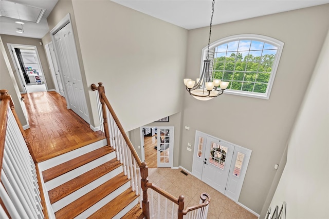 22 Restorative Ln, Middletown, NY 10940 - staircase featuring attic access, a chandelier, and baseboards