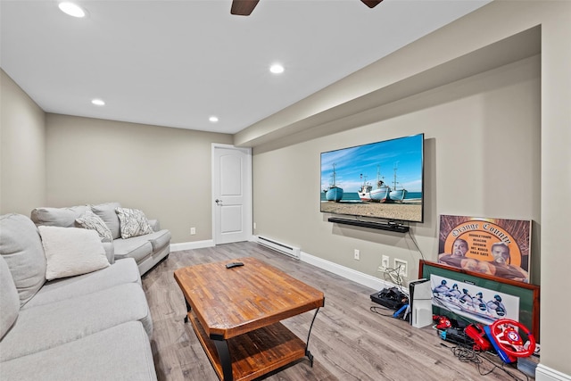 22 Restorative Ln, Middletown, NY 10940 - living area with a baseboard radiator, recessed lighting, wood finished floors, ceiling fan, and baseboards