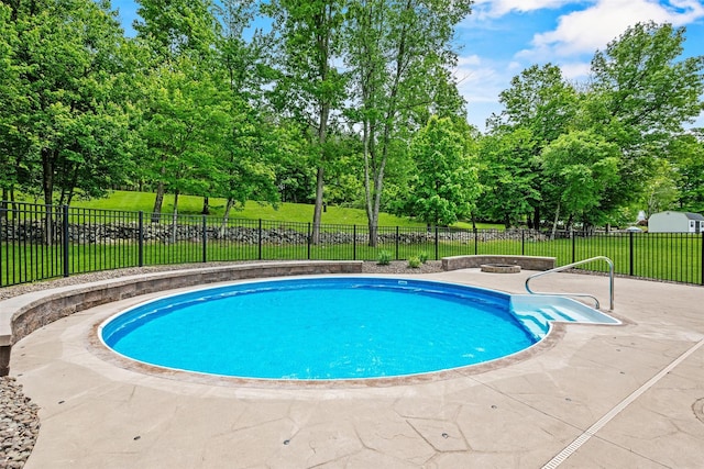 22 Restorative Ln, Middletown, NY 10940 - view of swimming pool with a fire pit, a patio, and view of wooded area
