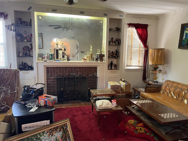 2449 Young Ave, Bronx, NY 10469 - living area with a fireplace, ceiling fan, and built in shelves