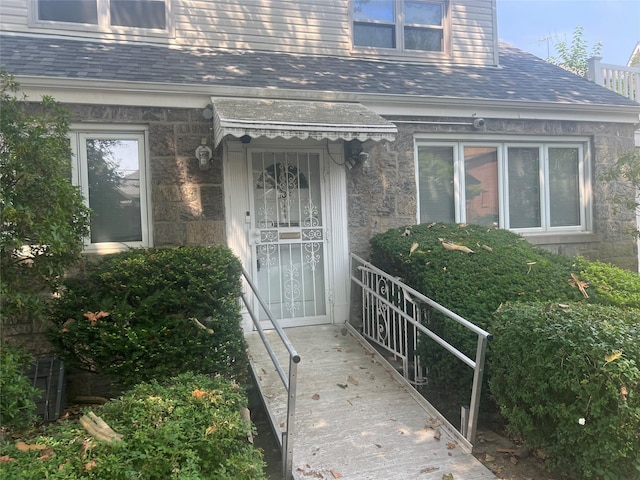 2449 Young Ave, Bronx, NY 10469 - property entrance featuring roof with shingles