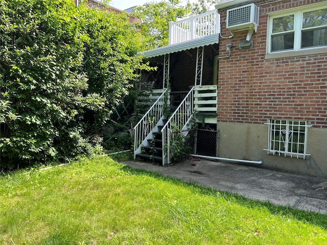 2449 Young Ave, Bronx, NY 10469 - exterior space featuring a wall unit AC and stairway