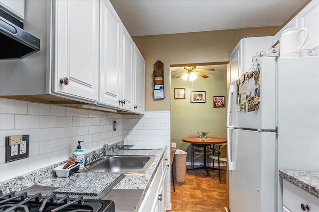 196-66 67th Ave Unit 1Fl, Fresh Meadows, NY 11365 - kitchen featuring freestanding refrigerator, exhaust hood, white cabinets, decorative backsplash, and ceiling fan