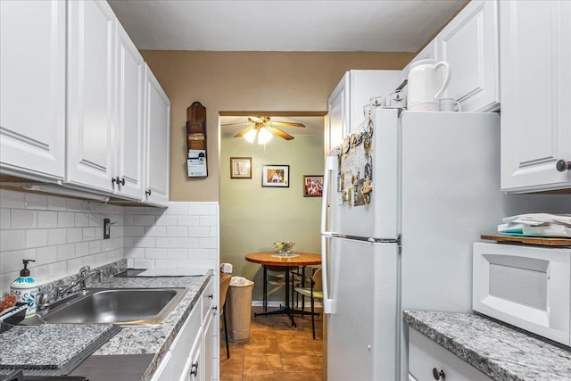 196-66 67th Ave Unit 1Fl, Fresh Meadows, NY 11365 - kitchen with white appliances, a sink, and white cabinets