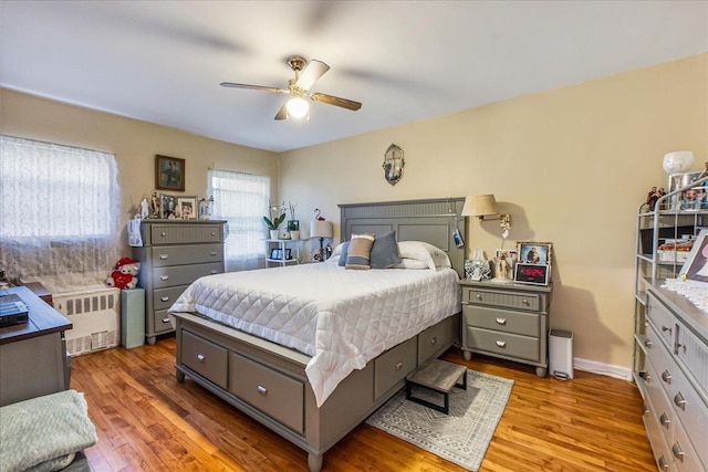196-66 67th Ave Unit 1Fl, Fresh Meadows, NY 11365 - bedroom with radiator, wood finished floors, and ceiling fan