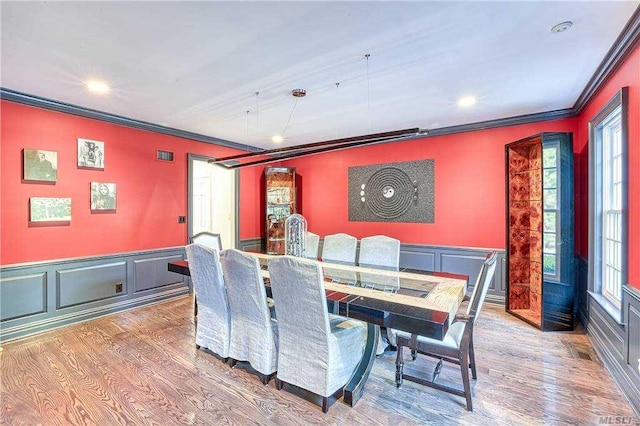 9 Stream Ct, Great Neck, NY 11024 - dining space featuring ornamental molding, wood finished floors, a decorative wall, recessed lighting, and a wainscoted wall