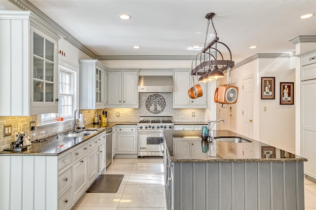9 Stream Ct, Great Neck, NY 11024 - kitchen with appliances with stainless steel finishes, a sink, wall chimney range hood, backsplash, and ornamental molding