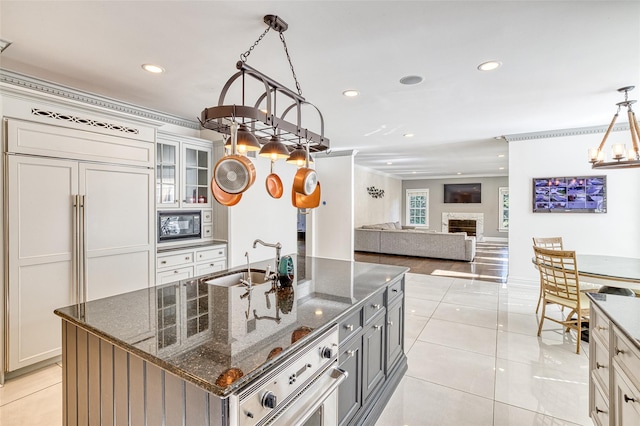 9 Stream Ct, Great Neck, NY 11024 - kitchen featuring a sink, light tile patterned floors, recessed lighting, black microwave, and a chandelier