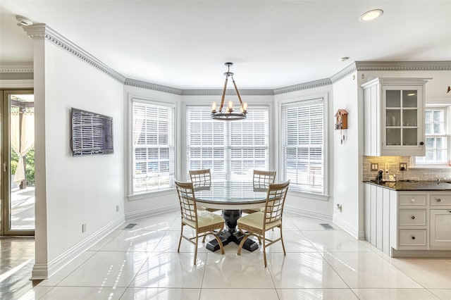 9 Stream Ct, Great Neck, NY 11024 - dining room with baseboards, a chandelier, ornamental molding, light tile patterned floors, and recessed lighting