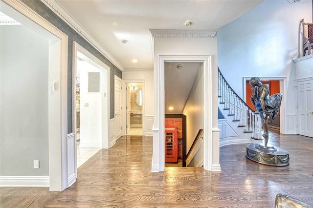 9 Stream Ct, Great Neck, NY 11024 - foyer entrance with wood finished floors, a decorative wall, ornamental molding, stairs, and recessed lighting