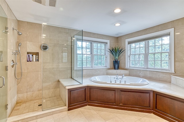 9 Stream Ct, Great Neck, NY 11024 - bathroom featuring a bath, a stall shower, tile patterned floors, and recessed lighting