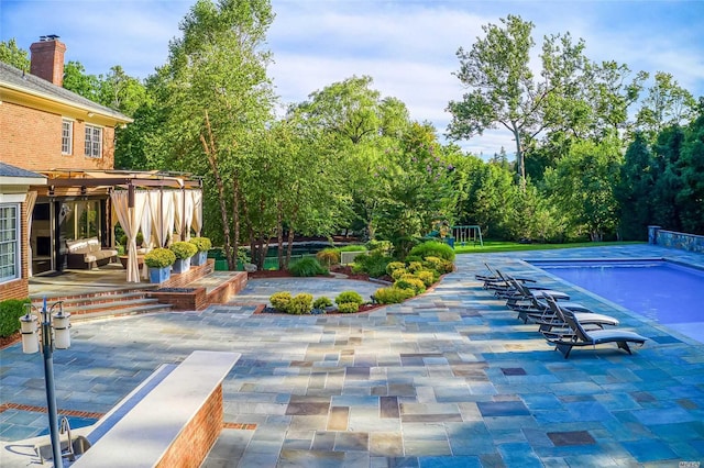 9 Stream Ct, Great Neck, NY 11024 - outdoor pool featuring a patio and view of scattered trees