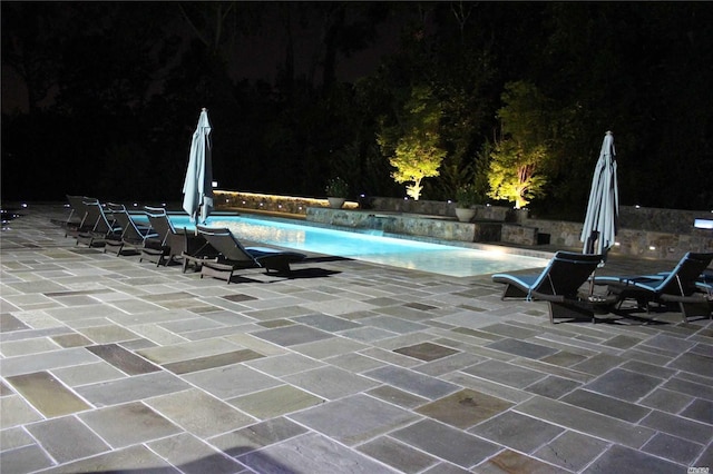 9 Stream Ct, Great Neck, NY 11024 - pool at twilight featuring a patio area and an outdoor pool