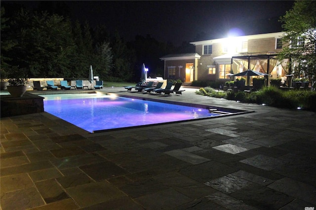9 Stream Ct, Great Neck, NY 11024 - pool at twilight with a patio and an outdoor pool