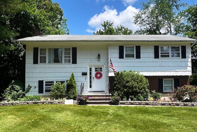 24 Rinne Rd, Nanuet, NY 10954 - bi-level home with a front lawn
