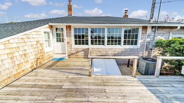 234 Dune Rd, Quogue, NY 11959 - wooden terrace featuring central AC
