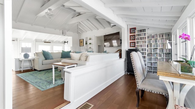 234 Dune Rd, Quogue, NY 11959 - living room featuring dark wood-style flooring and built in shelves