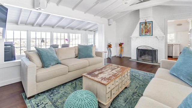 234 Dune Rd, Quogue, NY 11959 - living room featuring dark wood-type flooring and a fireplace
