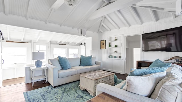 234 Dune Rd, Quogue, NY 11959 - living area featuring wood finished floors, built in features, and a barn door