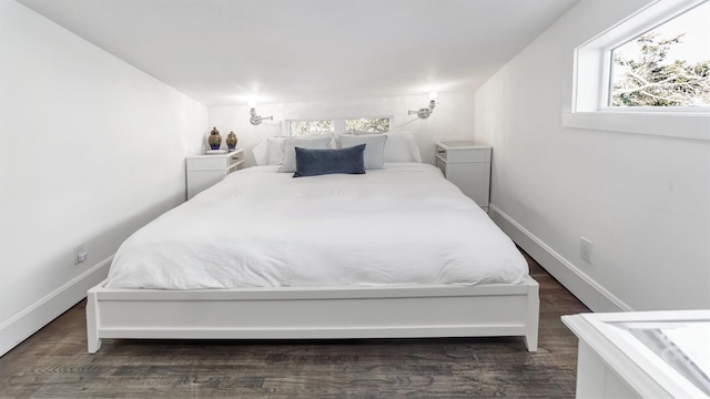 234 Dune Rd, Quogue, NY 11959 - bedroom with dark wood finished floors and baseboards