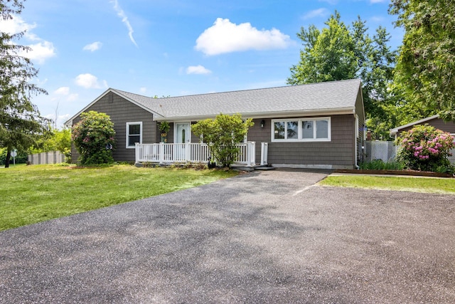 1 Chuck Ln, Selden, NY 11784 - ranch-style house with a porch, a shingled roof, and driveway