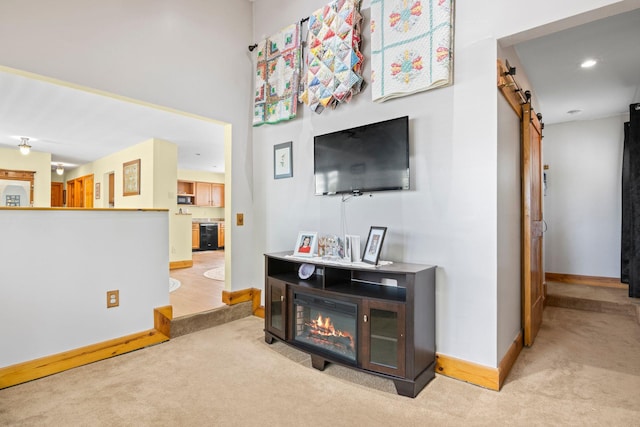 1 Chuck Ln, Selden, NY 11784 - living room with a barn door, carpet flooring, baseboards, and recessed lighting