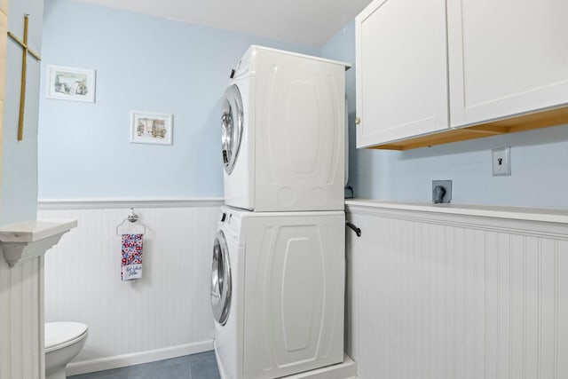 1 Chuck Ln, Selden, NY 11784 - laundry room with estacked washer and dryer, a wainscoted wall, and a decorative wall