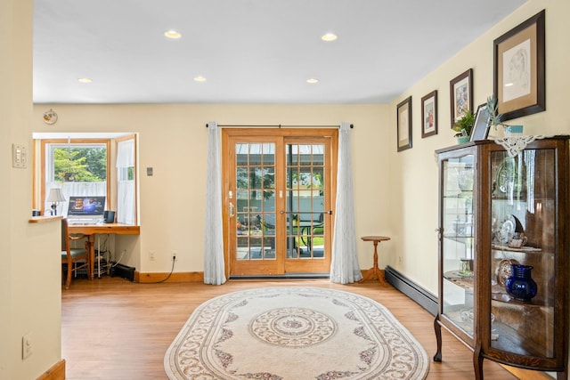 1 Chuck Ln, Selden, NY 11784 - doorway to outside featuring wood finished floors, a baseboard heating unit, recessed lighting, and baseboards