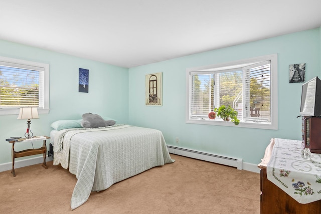 1 Chuck Ln, Selden, NY 11784 - bedroom featuring a baseboard heating unit, multiple windows, and light colored carpet