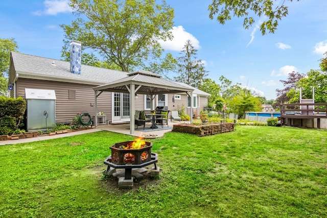 1 Chuck Ln, Selden, NY 11784 - rear view of property featuring an outdoor fire pit, a gazebo, a patio area, and a yard