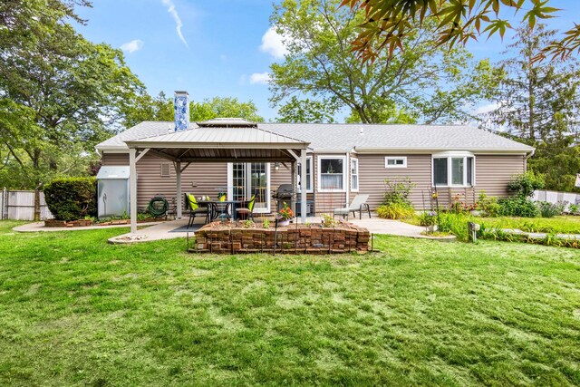 1 Chuck Ln, Selden, NY 11784 - back of property with a gazebo, a patio area, and a shingled roof