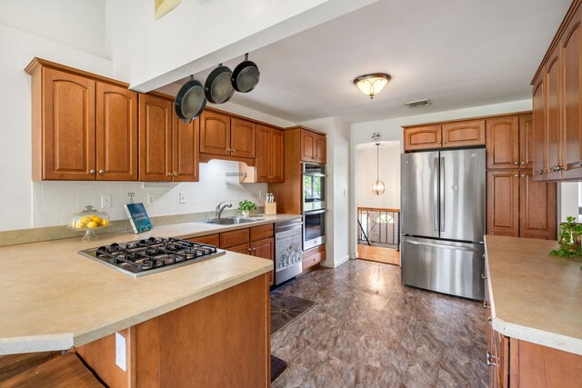 67 Keats Dr, New Windsor, NY 12553 - kitchen with stainless steel appliances, a sink, light countertops, and a peninsula