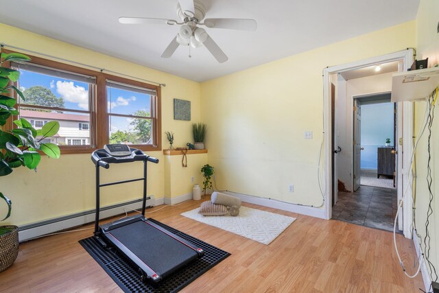 67 Keats Dr, New Windsor, NY 12553 - workout area featuring a baseboard radiator, ceiling fan, wood finished floors, and baseboards