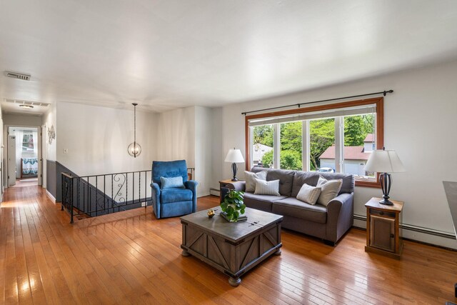 67 Keats Dr, New Windsor, NY 12553 - living room with hardwood / wood-style flooring, baseboard heating, and baseboards