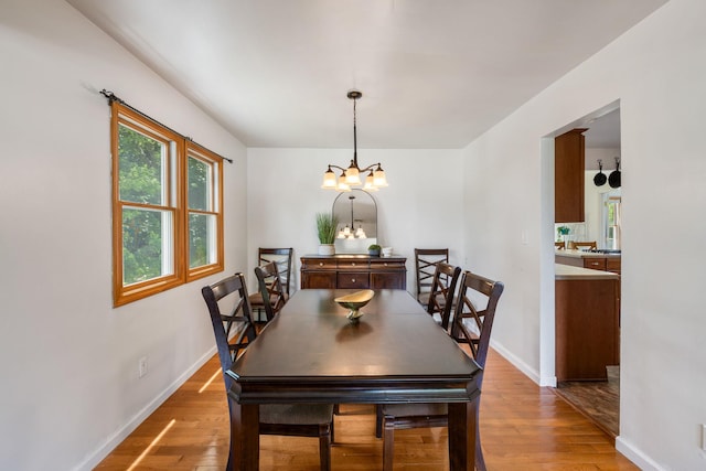 67 Keats Dr, New Windsor, NY 12553 - dining room featuring light wood-style floors, a chandelier, and baseboards