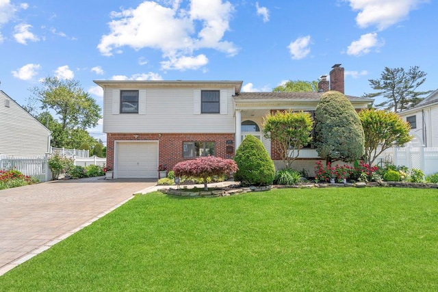 129 Colony Ln, Syosset, NY 11791 - split level home featuring driveway, brick siding, an attached garage, and a chimney