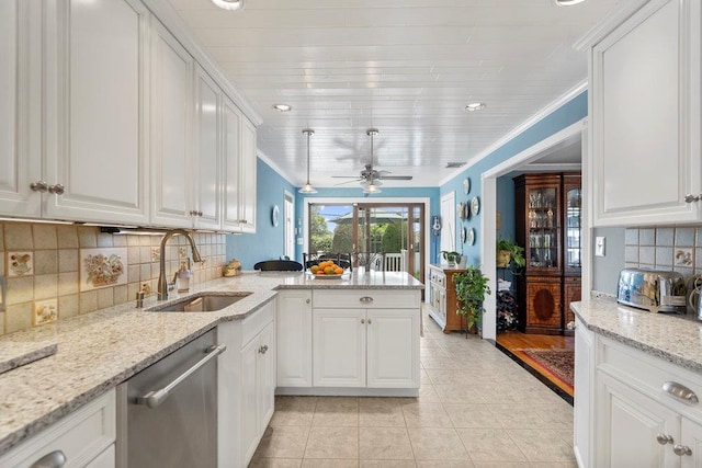 129 Colony Ln, Syosset, NY 11791 - kitchen featuring stainless steel dishwasher, a sink, a peninsula, light tile patterned floors, and white cabinets