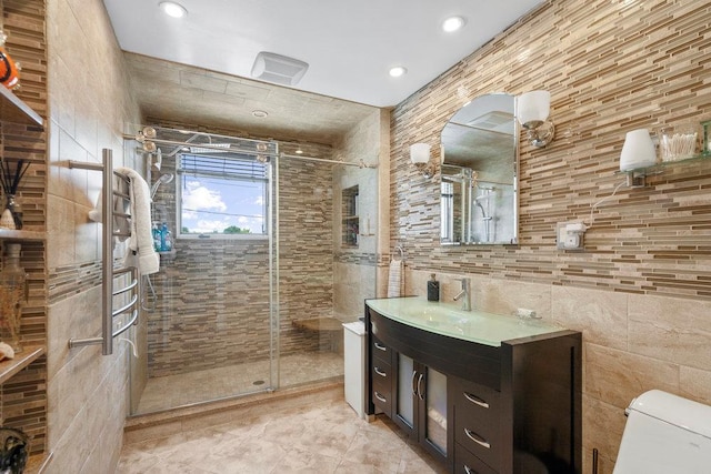 129 Colony Ln, Syosset, NY 11791 - full bathroom with tile walls, a shower stall, vanity, toilet, and recessed lighting